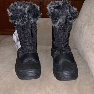 Women boots. Black with black and white fur. Keeps your feet warm and cozy.